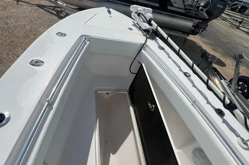 Slide: The Image of 2012 SeaHunter 29 boat interior with storage compartment and mounted equipment. - 17