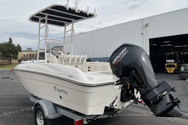 Slide: The Image of 2025 Bayliner Trophy T18 boat with Mercury outboard motor on a trailer. - 2