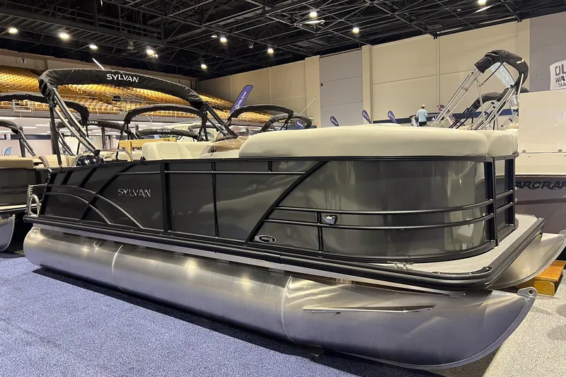 The Image of 2026 Sylvan Mirage 820 CLZ DH pontoon boat displayed indoors at a boat show. - 0