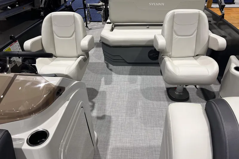 Slide: The Image of 2026 Sylvan Mirage 820 CLZ DH interior with plush seating and modern design. - 10