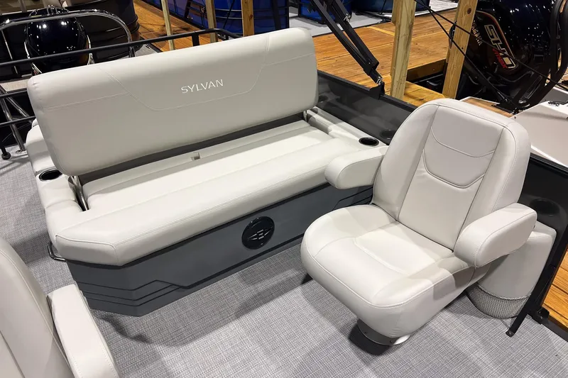 Slide: The Image of 2026 Sylvan Mirage 820 CLZ DH boat interior with plush seating and modern design. - 11