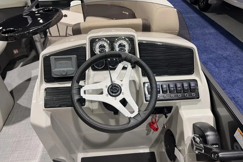 Slide: The Image of Steering console of 2026 Sylvan Mirage 820 CLZ DH boat with modern controls and gauges. - 16