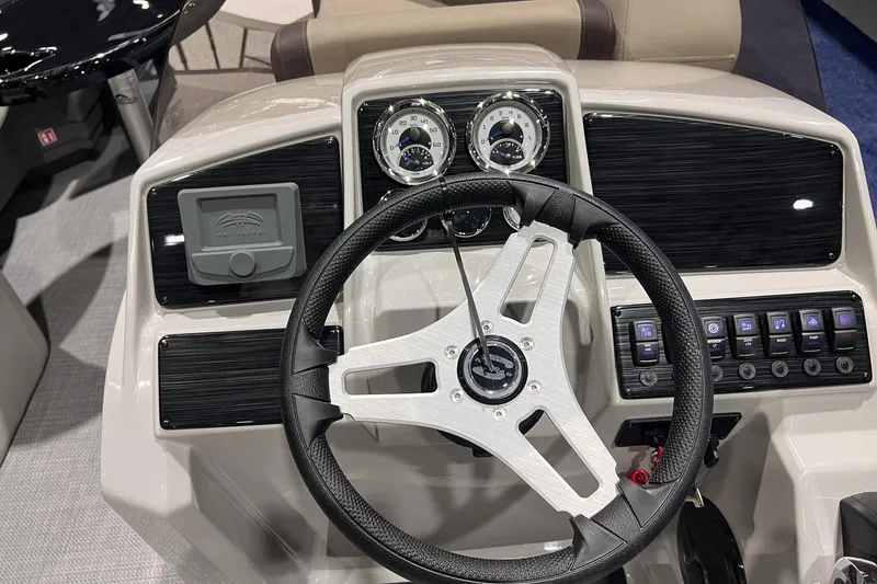 Slide: The Image of Steering console of 2026 Sylvan Mirage 820 CLZ DH with modern controls and gauges. - 17