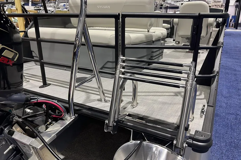 Slide: The Image of 2026 Sylvan Mirage 820 CLZ DH pontoon boat with ladder and seating area. - 5