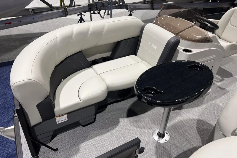 Slide: The Image of Luxurious seating area on 2026 Sylvan Mirage 820 CLZ DH boat with sleek table design. - 7