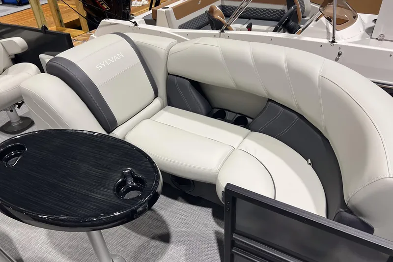 Slide: The Image of Luxurious seating on 2026 Sylvan Mirage 820 CLZ DH boat with sleek black table. - 9