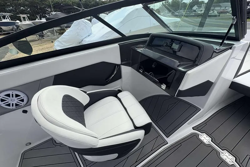 Slide: The Image of 2023 Monterey M-22 boat interior with sleek dashboard and comfortable seating. - 13