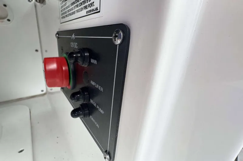 Slide: The Image of Control panel of 2023 Monterey M-22 boat with red emergency button and switches. - 17