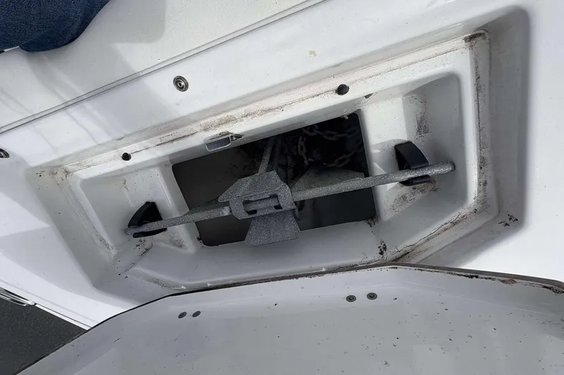 Slide: The Image of Anchor compartment of 2023 Monterey M-22 boat, showing anchor and chain storage. - 19