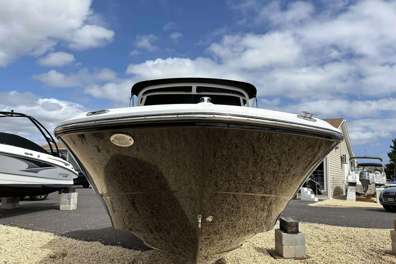 Slide: The Image of 2023 Monterey M-22 boat on display under a partly cloudy sky. - 5