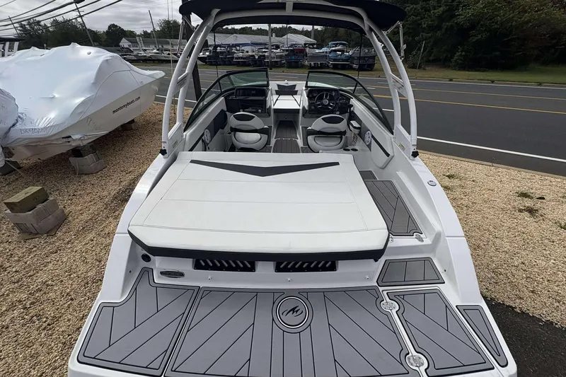 Slide: The Image of 2023 Monterey M-22 boat with sleek design, spacious seating, and modern dashboard. - 6