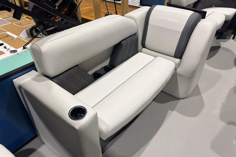 Slide: The Image of 2026 Sylvan Mirage Fish 820 Party Fish boat seat with cup holder, featuring sleek white and gray design. - 11