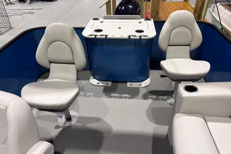 Slide: The Image of 2026 Sylvan Mirage Fish 820 Party Fish boat interior with seating and table. - 12