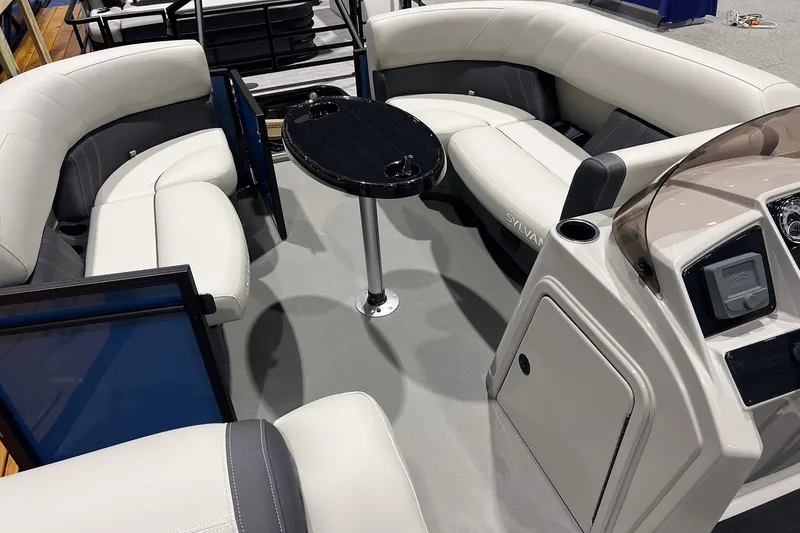 Slide: The Image of 2026 Sylvan Mirage Fish 820 Party Fish interior with plush seating and central table. - 16