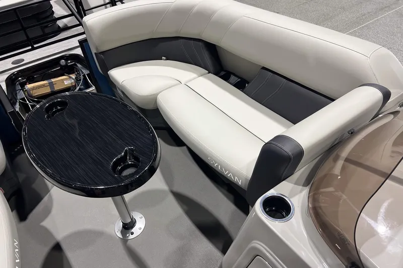 Slide: The Image of 2026 Sylvan Mirage Fish 820 Party Fish boat interior with seating and table. - 17