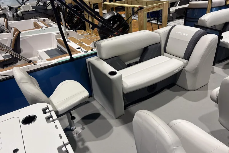 Slide: The Image of 2026 Sylvan Mirage Fish 820 Party Fish boat interior with plush seating and modern design. - 6