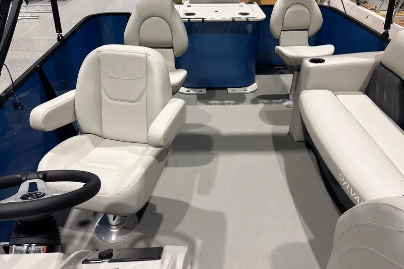 Slide: The Image of 2026 Sylvan Mirage Fish 820 Party Fish interior with white seating and steering wheel. - 8
