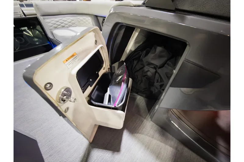 Slide: The Image of Open storage compartment on 2026 Godfrey Monaco 235 Sun Deck boat, showcasing interior space. - 13