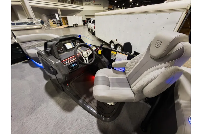 Slide: The Image of Luxurious interior of 2026 Godfrey Monaco 235 Sun Deck boat with modern helm and seating. - 14