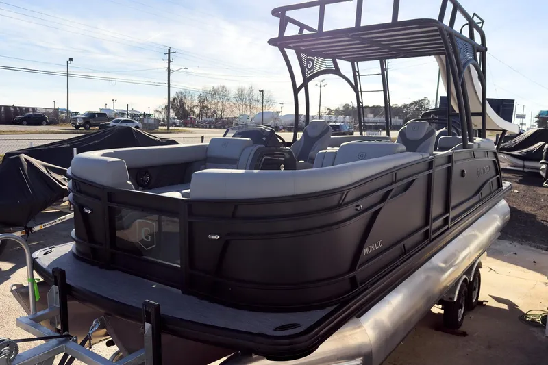 Slide: The Image of 2026 Godfrey Monaco 235 Sun Deck boat with sleek black design and spacious seating. - 24