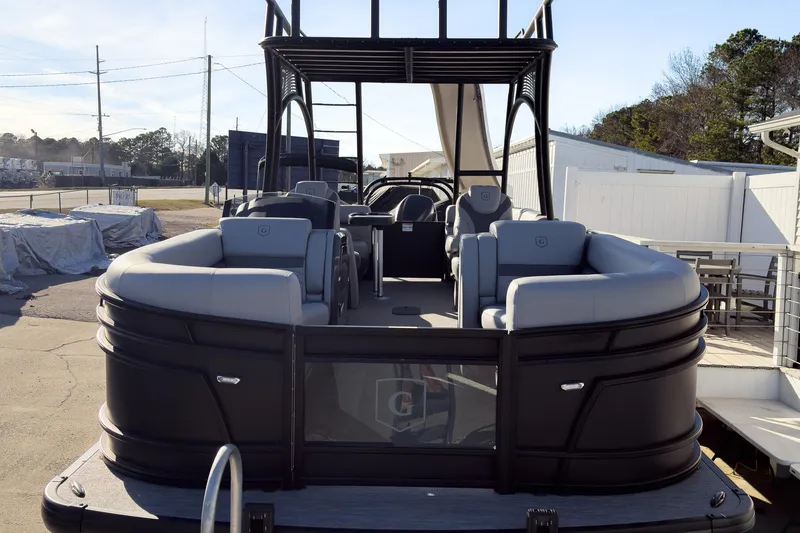 Slide: The Image of 2026 Godfrey Monaco 235 Sun Deck boat with spacious seating and modern design. - 25