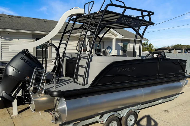 Slide: The Image of 2026 Godfrey Monaco 235 Sun Deck boat with slide and Suzuki engine on trailer. - 28