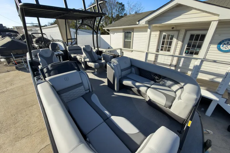 Slide: The Image of 2026 Godfrey Monaco 235 Sun Deck boat with luxurious seating and modern design. - 34