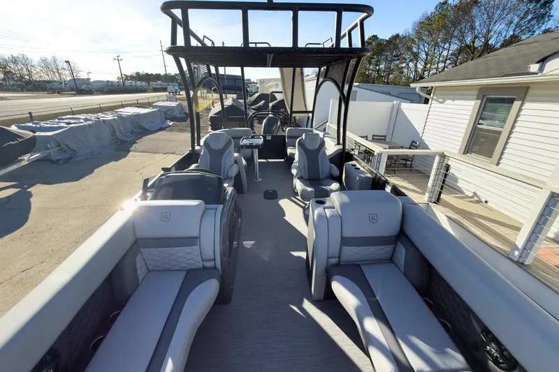 Slide: The Image of 2026 Godfrey Monaco 235 Sun Deck boat with luxurious seating and modern design. - 36