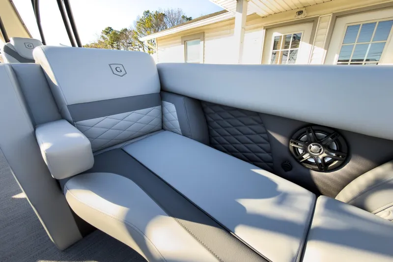 Slide: The Image of Luxurious seating on 2026 Godfrey Monaco 235 Sun Deck boat with integrated speaker system. - 38