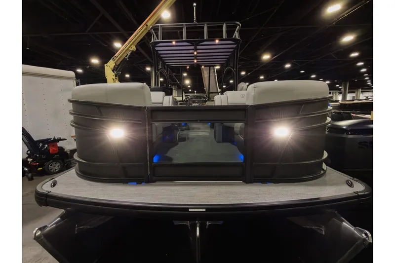 Slide: The Image of 2026 Godfrey Monaco 235 Sun Deck boat with illuminated deck and seating area. - 4