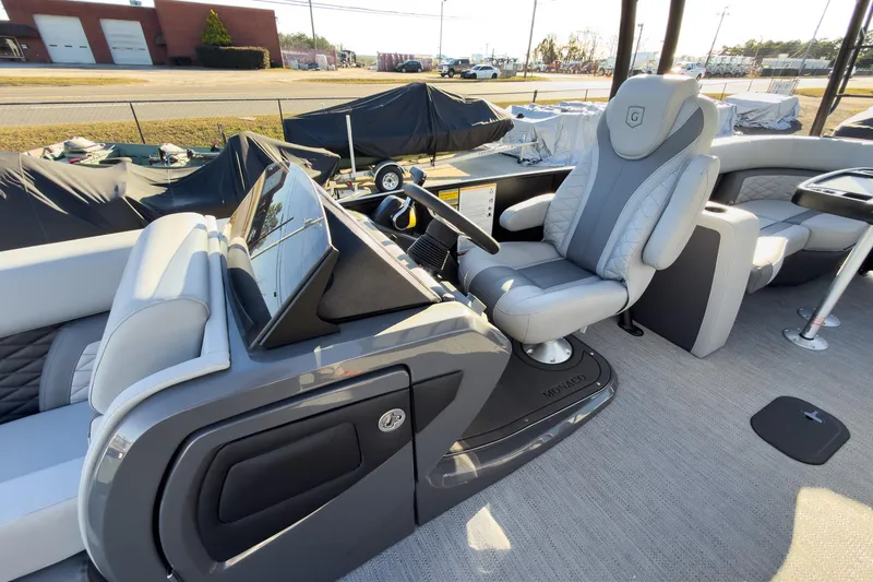 Slide: The Image of 2026 Godfrey Monaco 235 Sun Deck interior with modern helm and luxurious seating. - 44