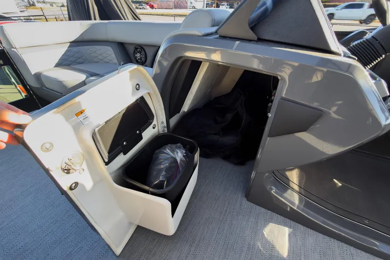 Slide: The Image of 2026 Godfrey Monaco 235 Sun Deck storage compartment with open door, showcasing interior features. - 47