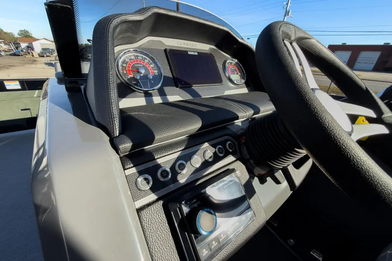 Slide: The Image of Dashboard of 2026 Godfrey Monaco 235 Sun Deck boat with steering wheel and gauges. - 50
