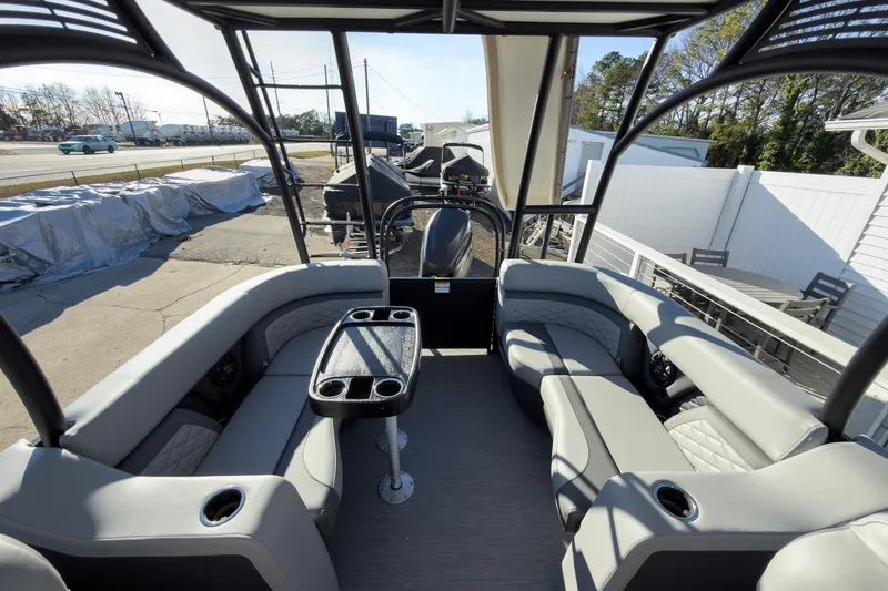 Slide: The Image of 2026 Godfrey Monaco 235 Sun Deck boat interior with spacious seating and table. - 57
