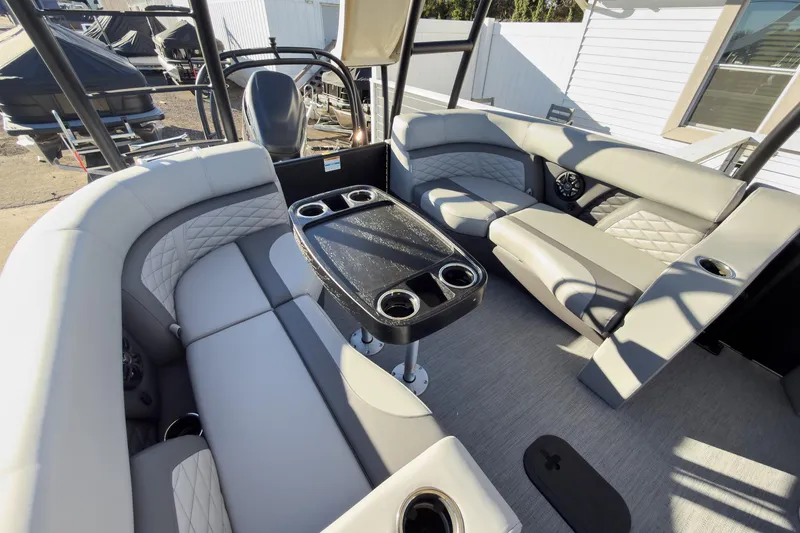 Slide: The Image of Luxurious seating area on 2026 Godfrey Monaco 235 Sun Deck boat with cup holders. - 59