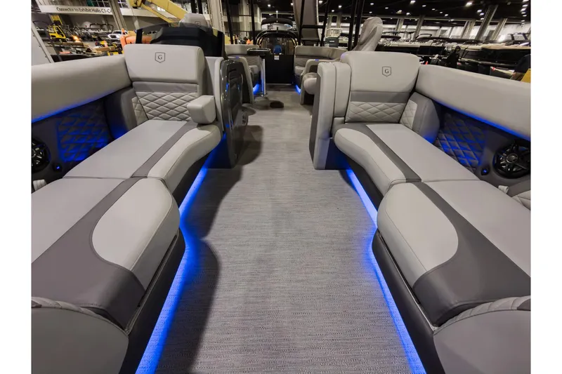 Slide: The Image of Luxurious interior of 2026 Godfrey Monaco 235 Sun Deck boat with ambient blue lighting. - 7