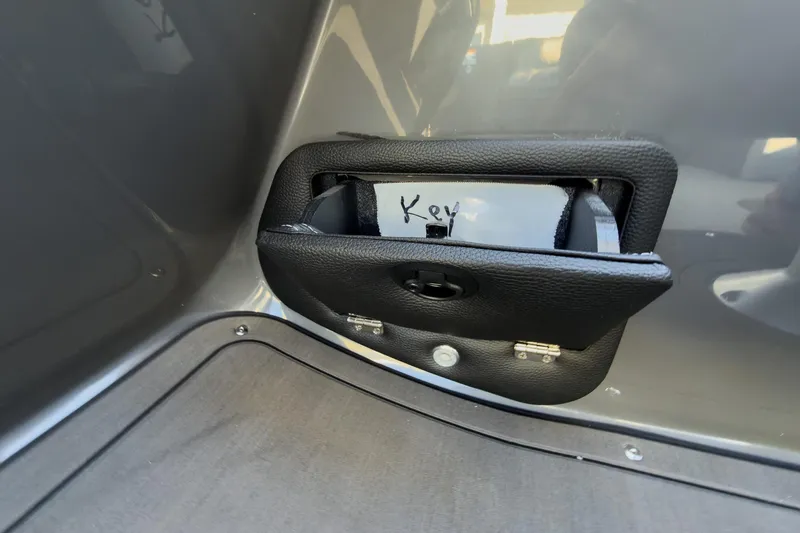 Slide: The Image of Storage compartment labeled "Key" on 2026 Godfrey Monaco 235 Sun Deck boat. - 72