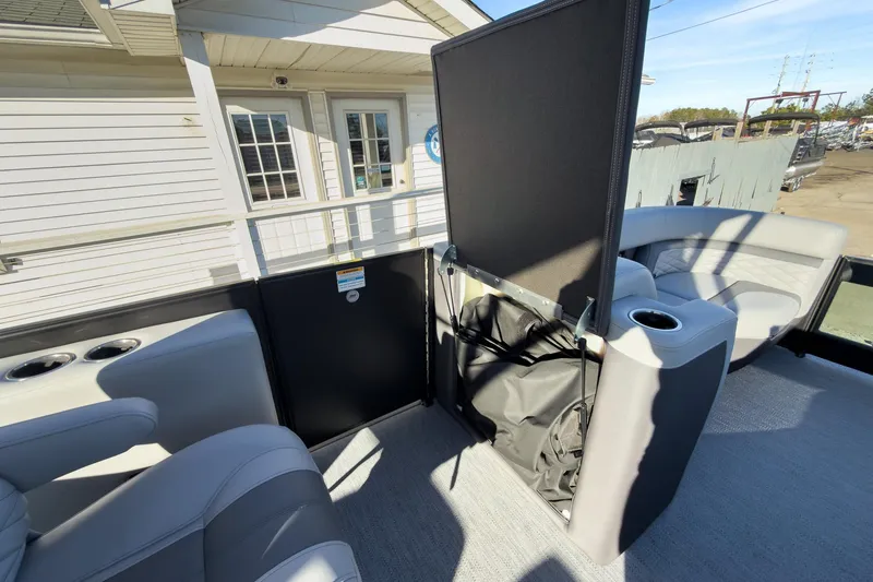 Slide: The Image of 2026 Godfrey Monaco 235 Sun Deck interior with seating and storage features. - 77