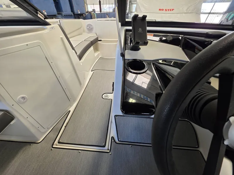 Slide: The Image of Interior of 2026 Yamaha AR220 boat with modern seating and controls. - 14