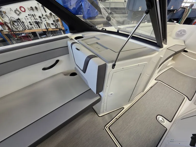 Slide: The Image of Interior of 2026 Yamaha AR220 boat with gray upholstery. - 19