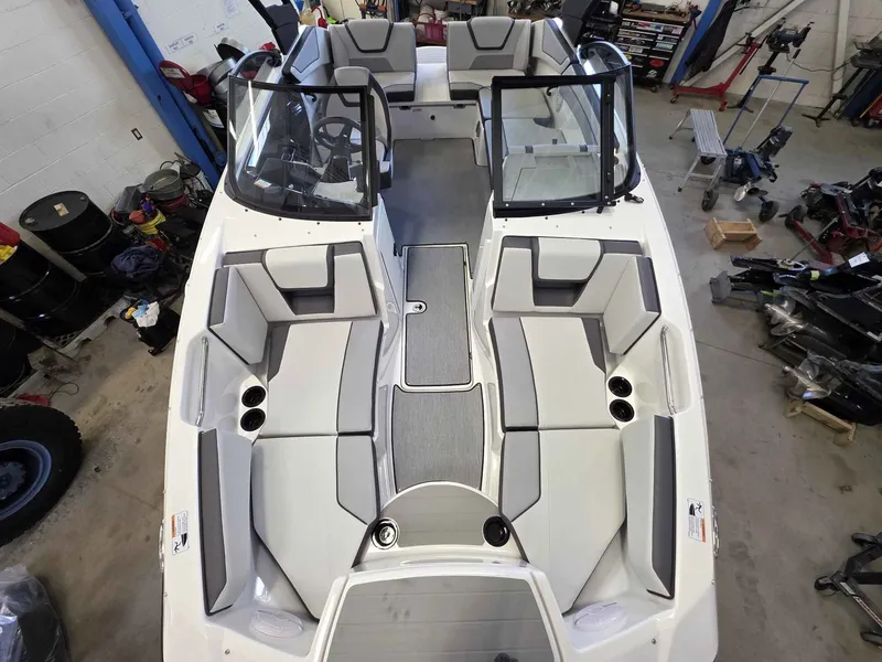 Slide: The Image of Interior view of a 2026 Yamaha AR220 boat in a workshop. - 24