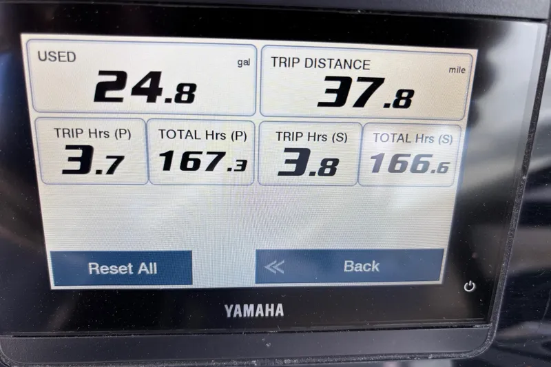 Slide: The Image of Display screen showing fuel usage and trip data for 2024 Cobia 280 Dual Console. - 10