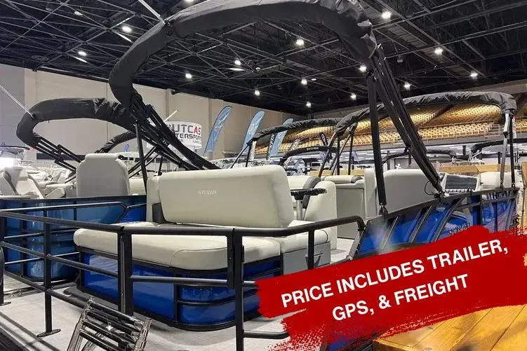 Slide: The Image of 2026 Sylvan Mirage 822 CLZ pontoon boat displayed indoors, price includes trailer, GPS, and freight. - 21
