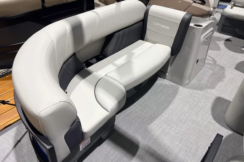 Slide: The Image of 2026 Sylvan Mirage 822 CLZ boat interior with stylish seating and modern design. - 6