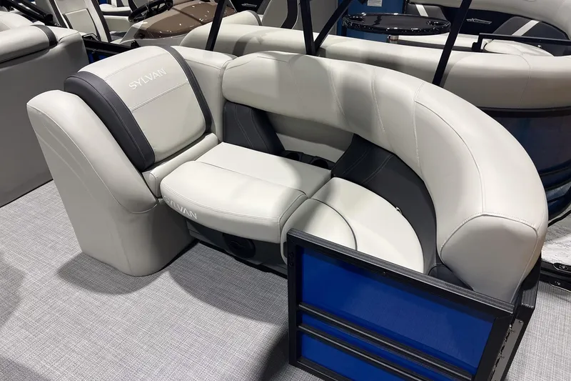 Slide: The Image of 2026 Sylvan Mirage 822 CLZ boat interior with luxurious white seating and modern design. - 7