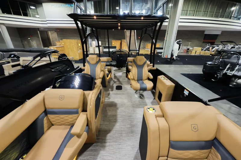 Slide: The Image of Luxurious interior of 2026 Godfrey Monaco 255 Sun Deck boat with tan seating. - 11