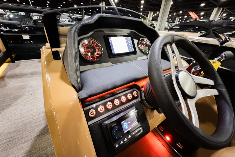 Slide: The Image of 2026 Godfrey Monaco 255 Sun Deck dashboard with modern controls and steering wheel. - 15