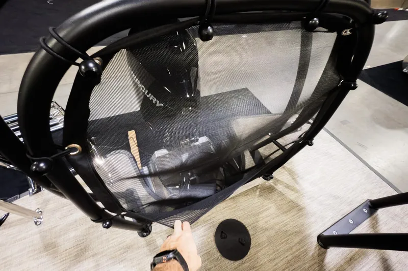 Slide: The Image of 2026 Godfrey Monaco 255 Sun Deck boat with mesh safety barrier and Mercury engine. - 27