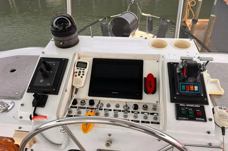 Slide: The Image of Control panel of a 1985 Hartman-Palmer 60 Flush Deck Motor Yacht with navigation instruments. - 11