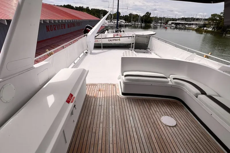 Slide: The Image of 1985 Hartman-Palmer 60 Flush Deck Motor Yacht with spacious deck and marina view. - 13